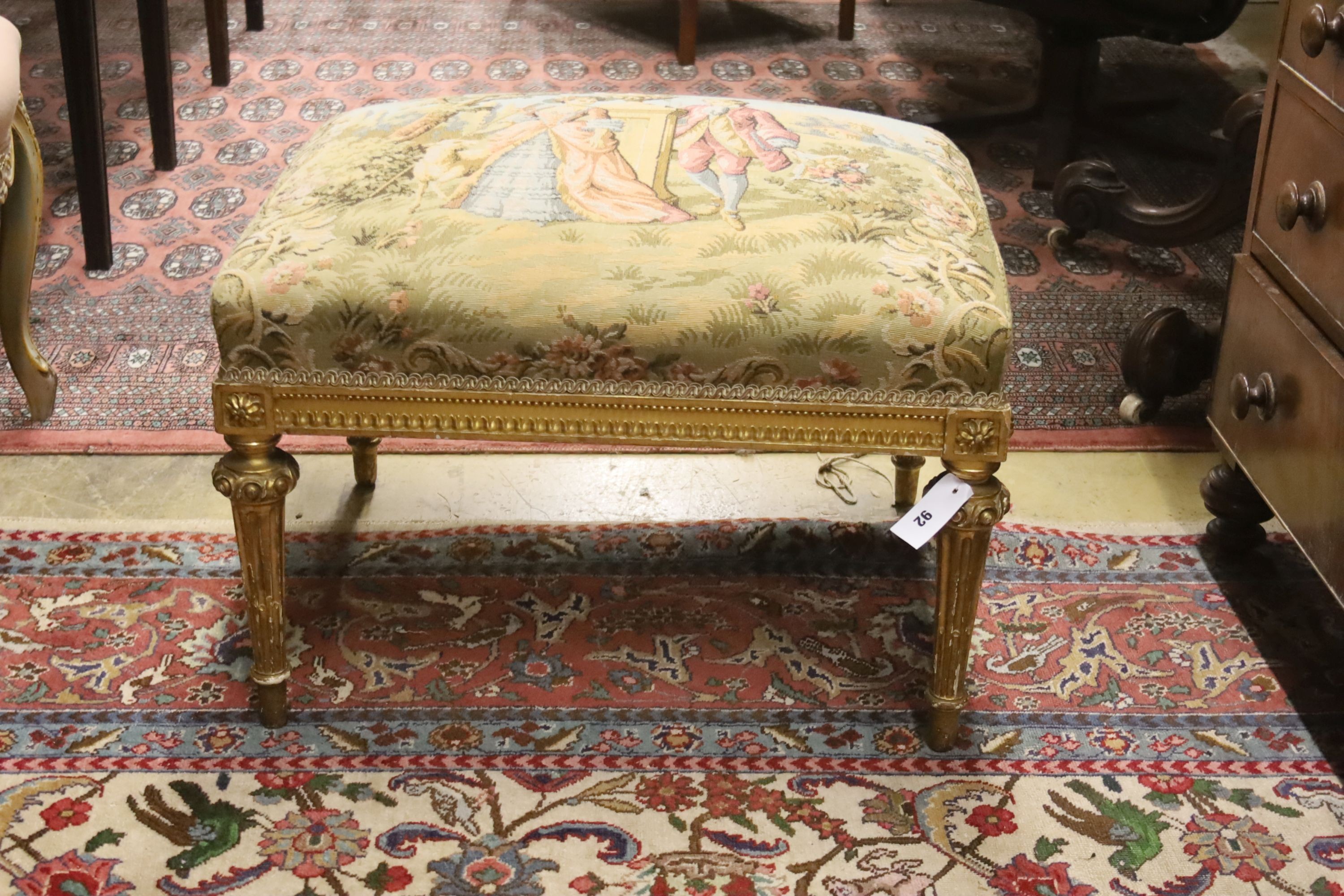 An 18th century style rectangular giltwood dressing stool with tapestry seat